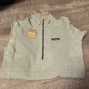 Brand new Patagonia woman’s R1 Air Zip neck.